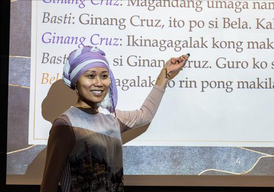 Mary Encabo-Bischoff gives a presentation at an anthropology club meeting.