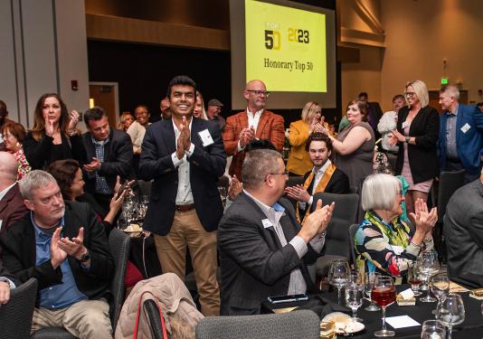 People are clapping at the 2023 Top 50 event