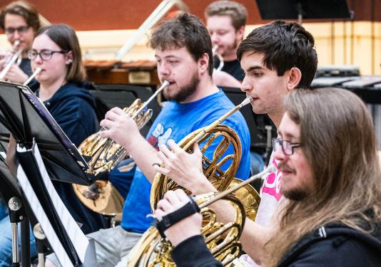 French horn section of the PFW Symphonic Wind Ensemble