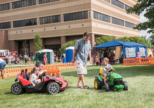 A father and his kids at children's fest