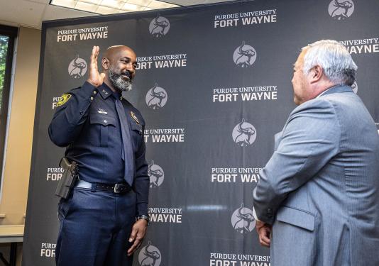 Chief Anthony Harrison was sworn in by Glen Nakata, PFW’s vice chancellor for financial and administrative affairs.
