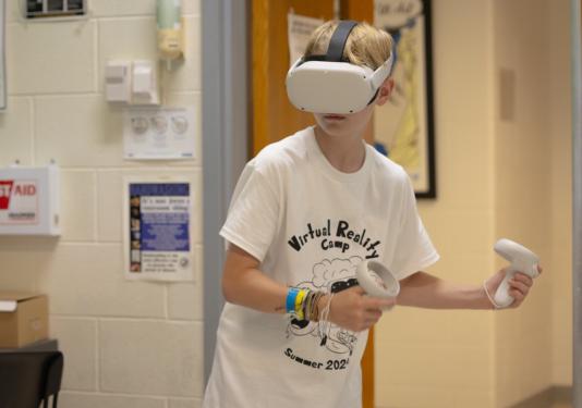 A student with a virtual reality visor