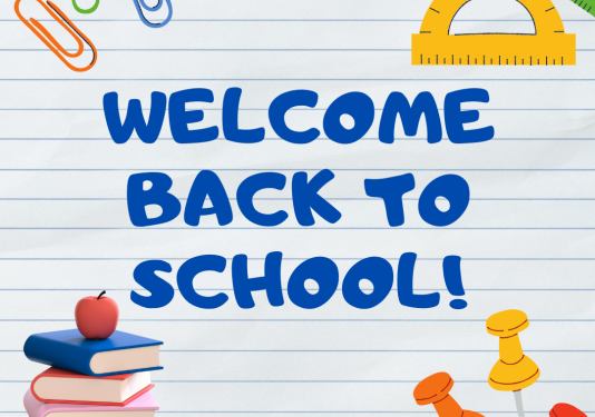 A colorful sign with the words "Welcome Back to school" in blue and books, paperclips, and push pins on the corners