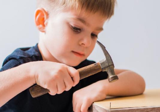 child making wood blocks