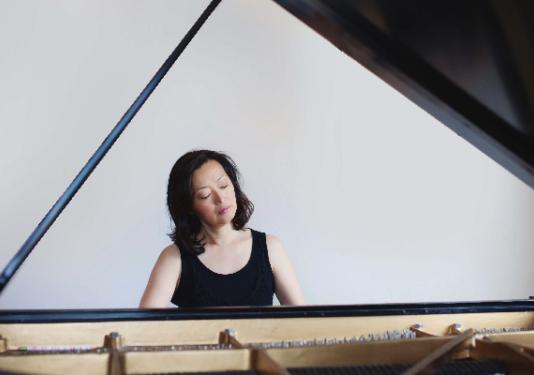 woman playing piano