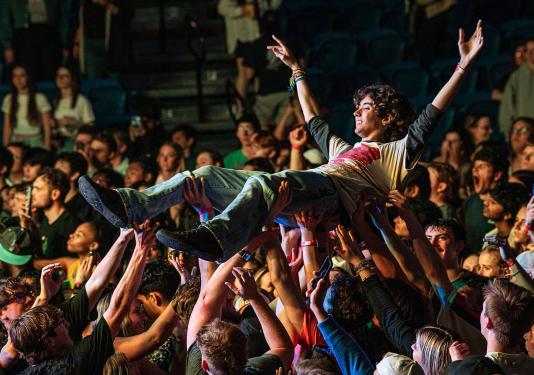 Crowd surfing at a Flo Rida concert