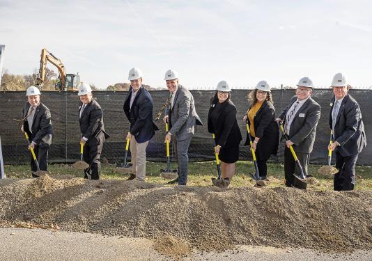 Turning over dirt at the Student Housing groudbreaking