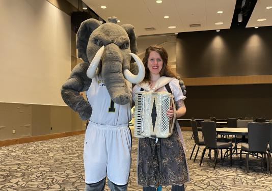 Mascot with musician in Ballroom