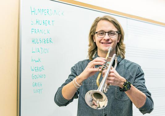 Austin Hulsizer is holding a trumpet