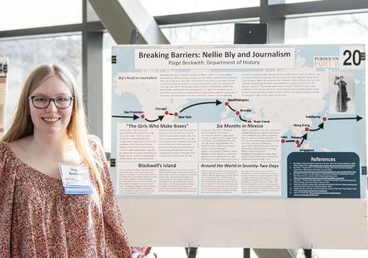 Paige Beckwith and her research poster