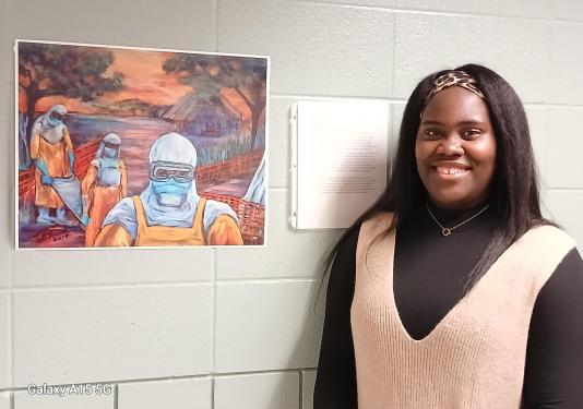 Chichi Jasper-Duruzor and the painting “Ebola.”