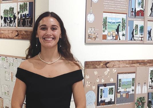 woman infront of original art