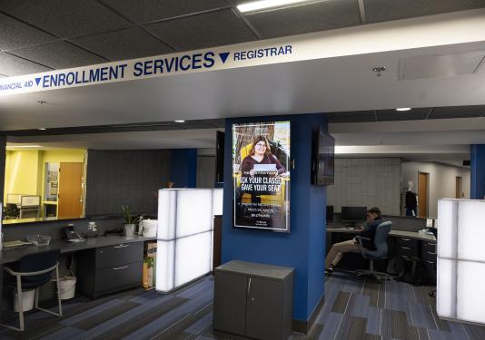 A digital display mounted vertically in Kettler Hall