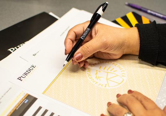 Purdue University branded documents and office supplies.