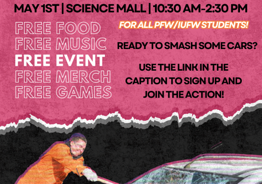 A male in an orange jumpsuit using a sledgehammer to smash the window on a grey car