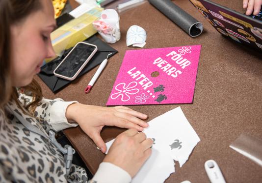 PFW senior decorates a cap for commencement.