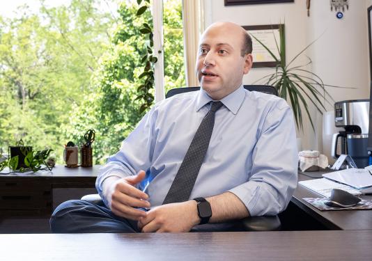 Chadi Braish at the desk in his office
