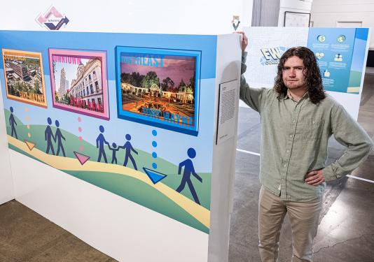 Zach Macke with a display he created