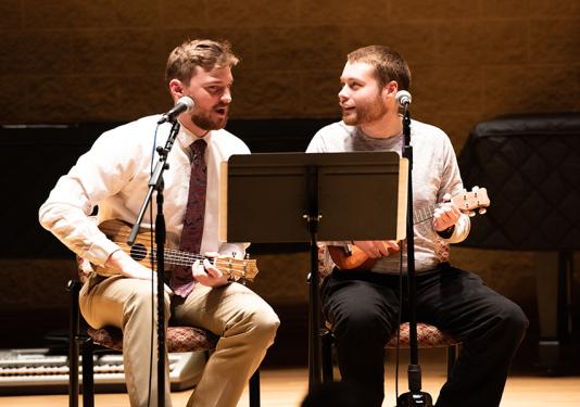 two people playing music together
