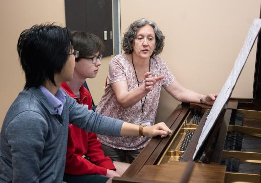 Susan Dorion is working with music students