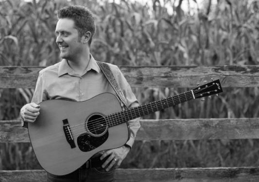 man holding guitar