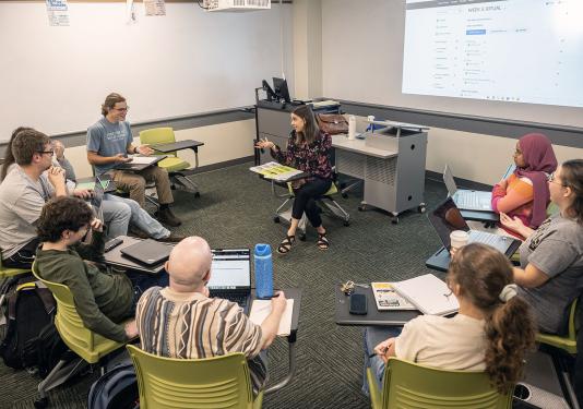 Students are sitting in a circle