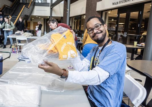 Photo of student making a kit