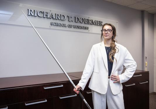 Emilia Russell is holding a javelin