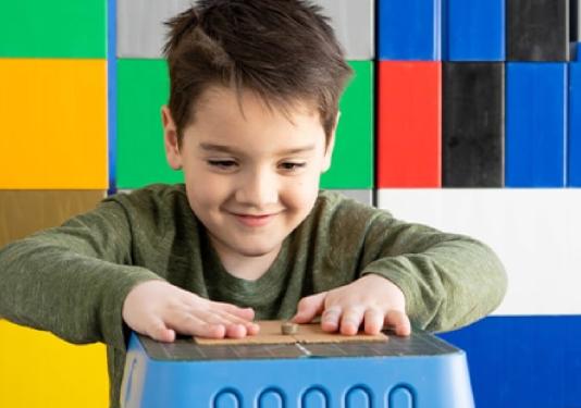 child playing with paper