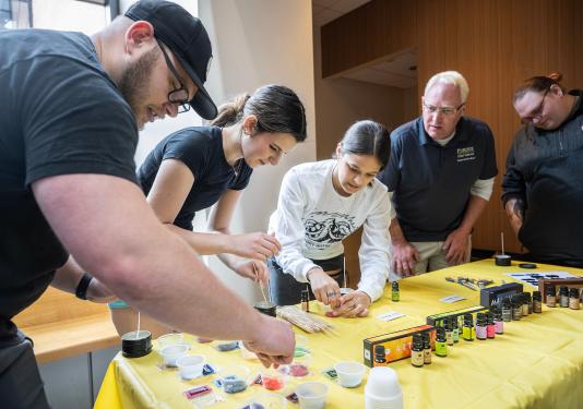 students at a craft table