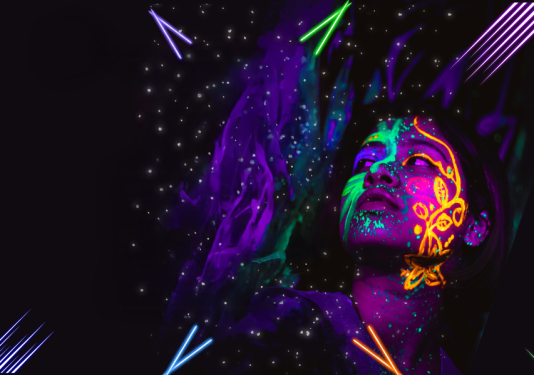 A face covered in bright neon colors