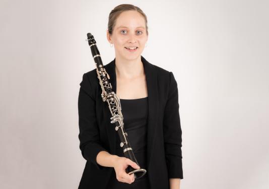woman holding clarinet
