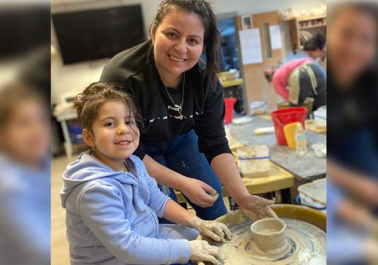 child making clay pottery