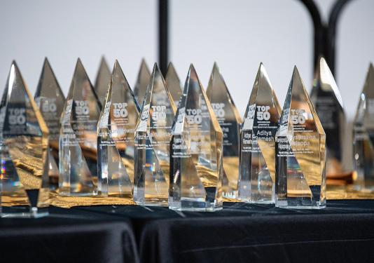 Several Top 50 awards are on a table