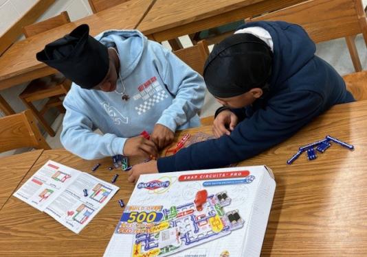 High School students working on circuit connection activity together