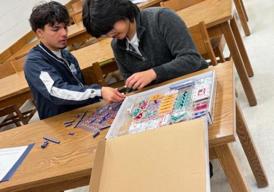 High School students working on a circuit connection activity