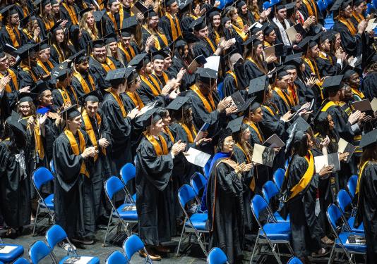 Group shot of many graduates at commencement