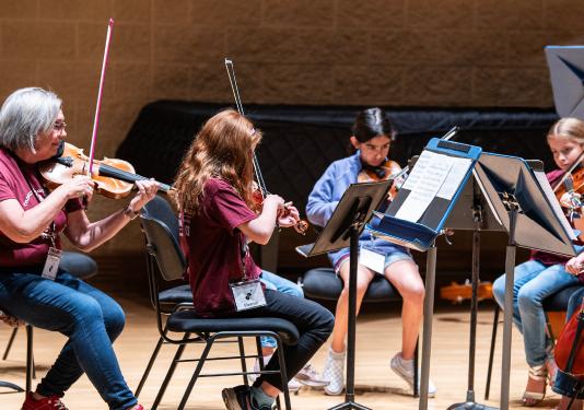 children playing violins