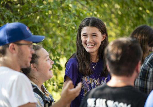 Students gathering outside laughing