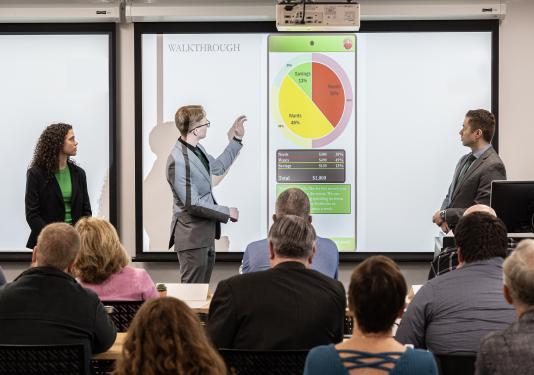 Students presenting at a confernce.