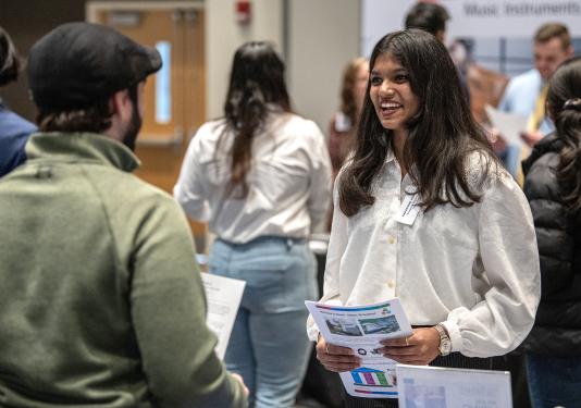 Student speaking with prospective future employer