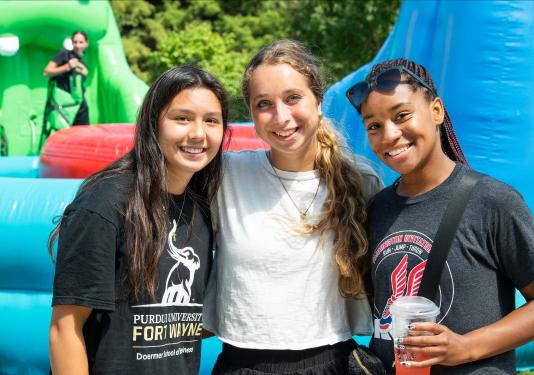 Three smiling students