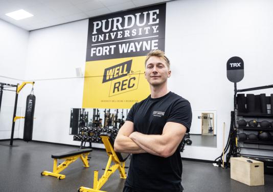 Sebastien Wilson is in a weight room at a gym