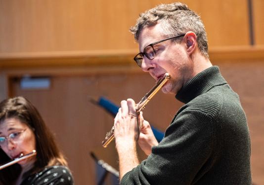 man playing flute