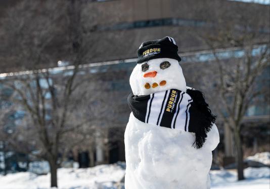 Photo of a snowman dressed in Purdue garb.
