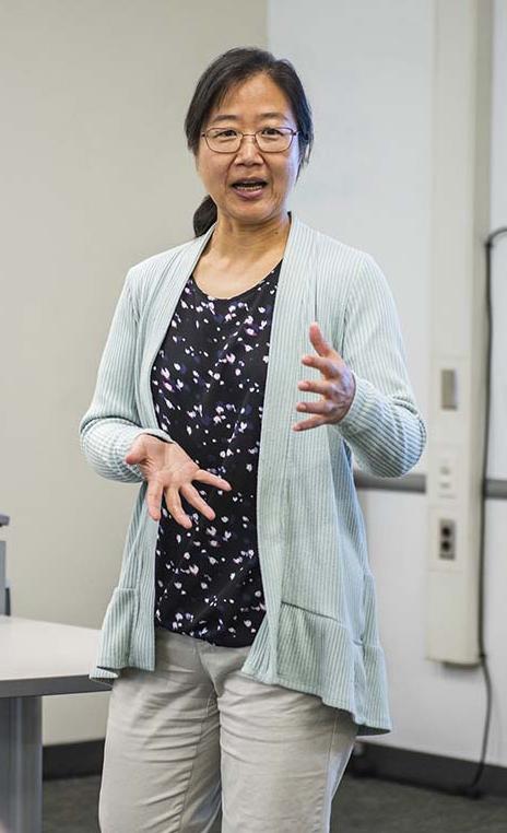 Professor Chao Chen teaching in a classroom
