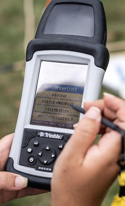 PFW student using an instrument at an anthropology dig