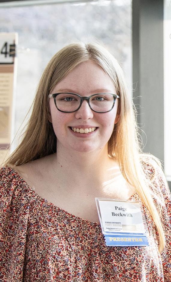 Paige Beckwith and her research poster