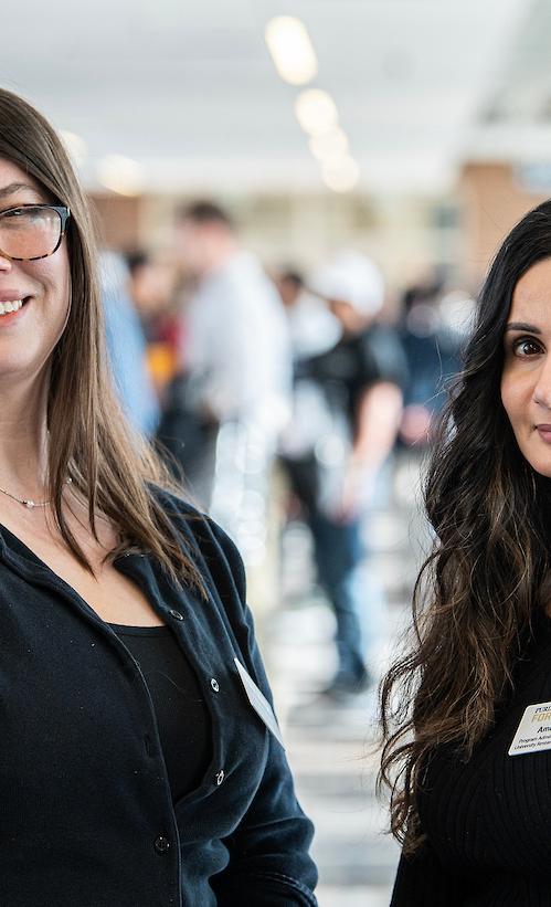Two woman smiling