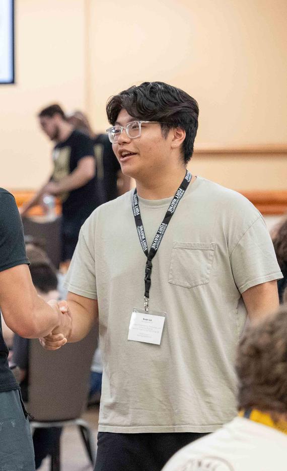 Students greet each other at NSO bingo night
